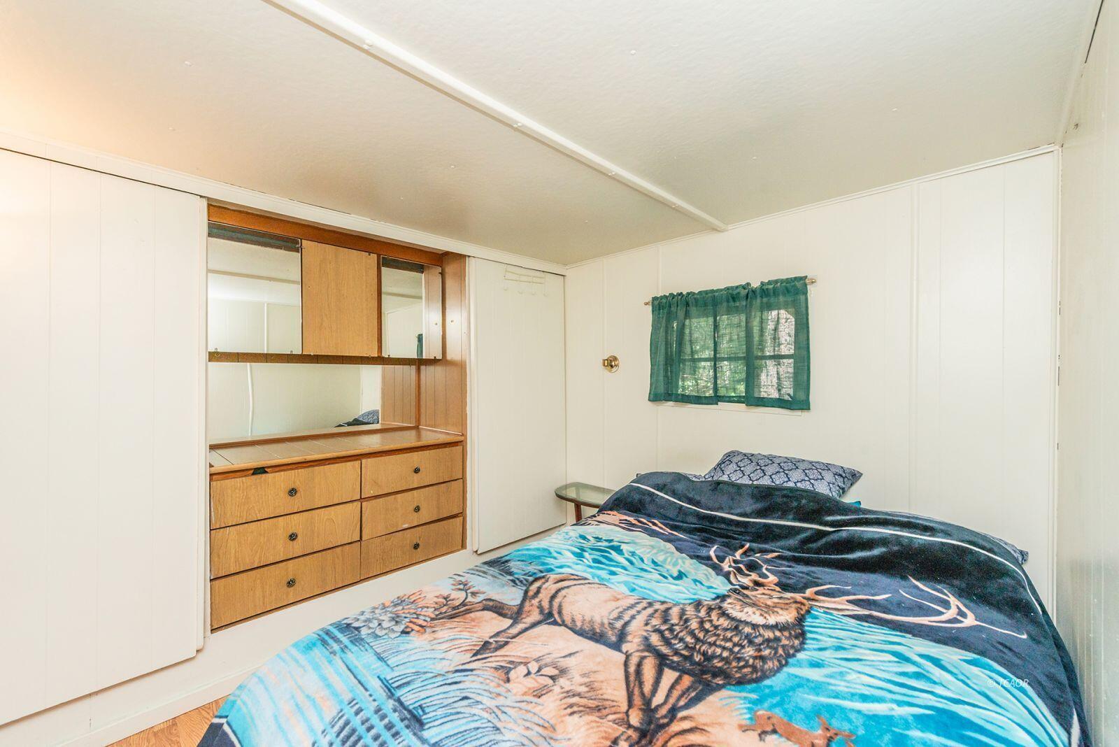 2940 Dutch Creek Road Junction City, CA 96048 - Photo 18 of 47 a bedroom with a bed and a window