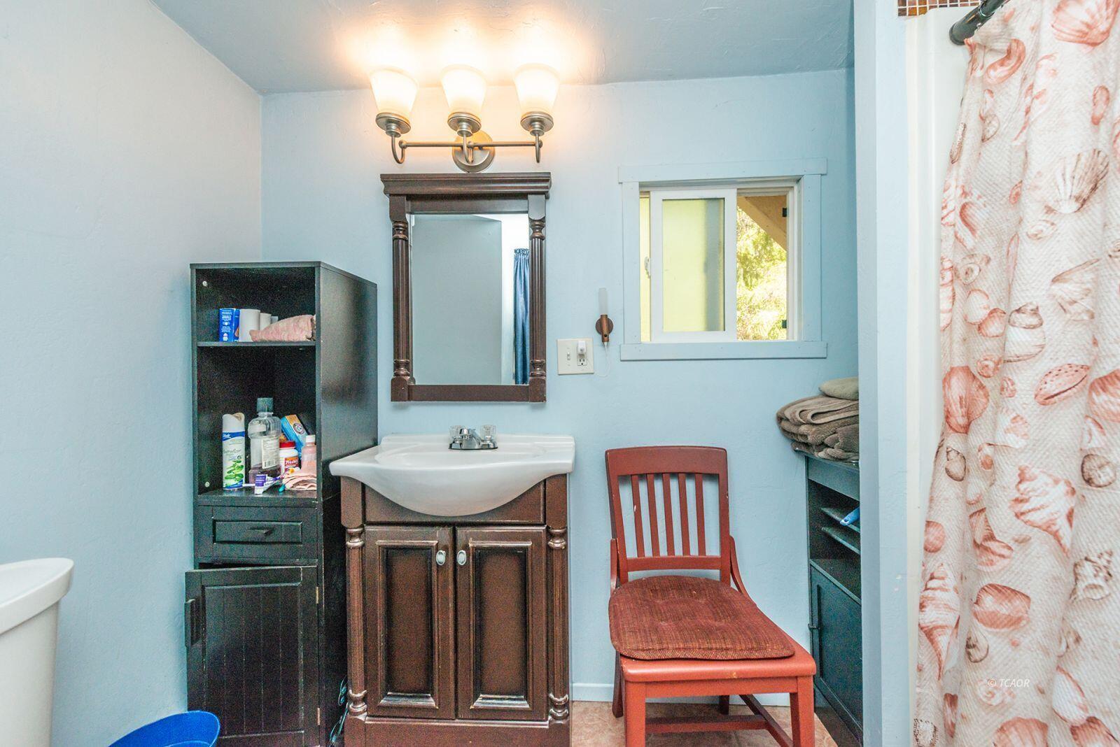2940 Dutch Creek Road Junction City, CA 96048 - Photo 21 of 47 a bathroom with a sink a mirror and a toilet