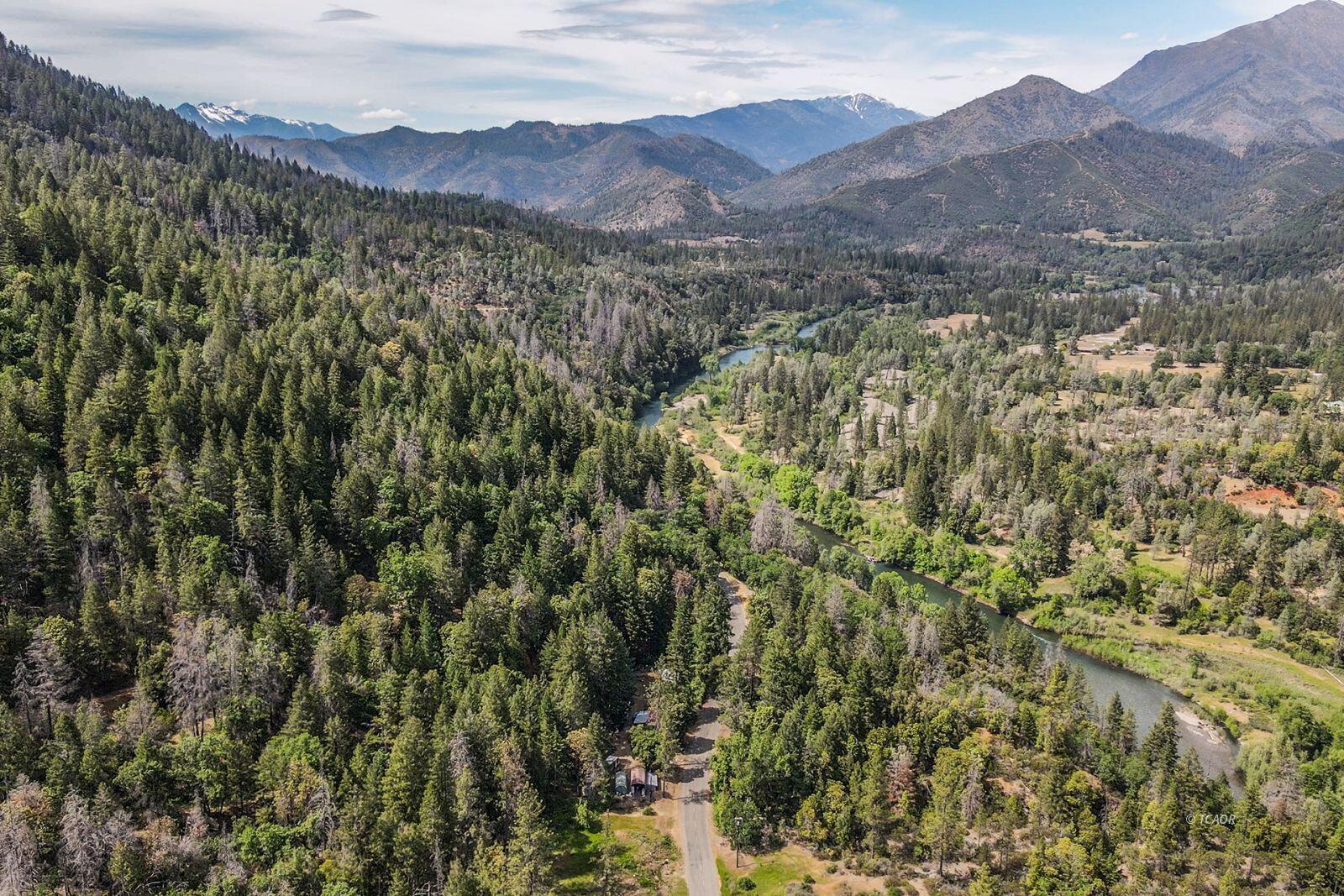 2940 Dutch Creek Road Junction City, CA 96048 - Photo 45 of 47 a view of a lush green hillside and a houses