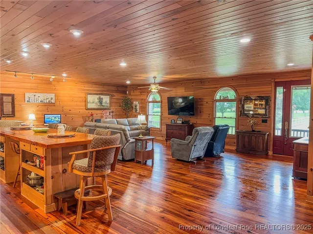 an open kitchen with a table and chairs