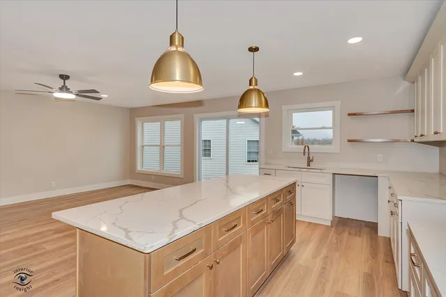 a kitchen with sink cabinets and window
