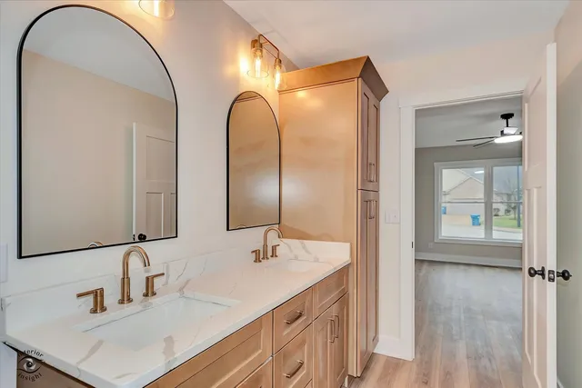 a bathroom with a sink and a mirror