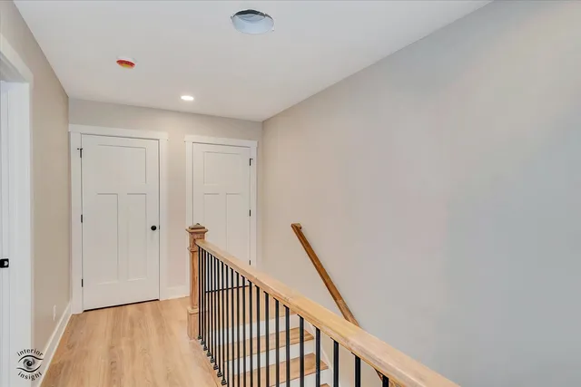 an empty room with ceiling fan and window