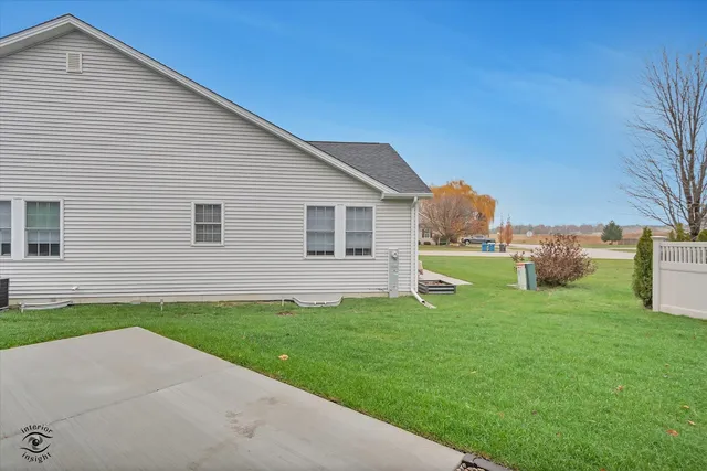 a front view of house with yard and outdoor seating