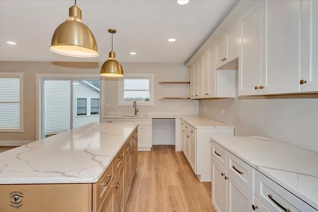 a kitchen with a sink cabinets and window