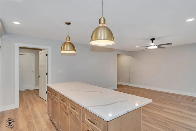 a room with a bed and a chandelier