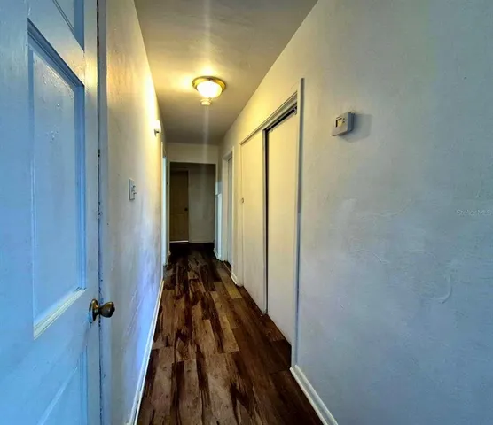 a view of an empty room with a window