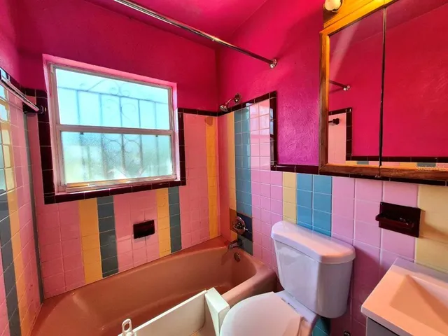 a bathroom with a sink a mirror and a shower