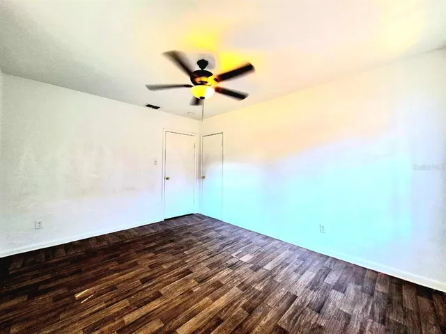 a view of a yard with a tree