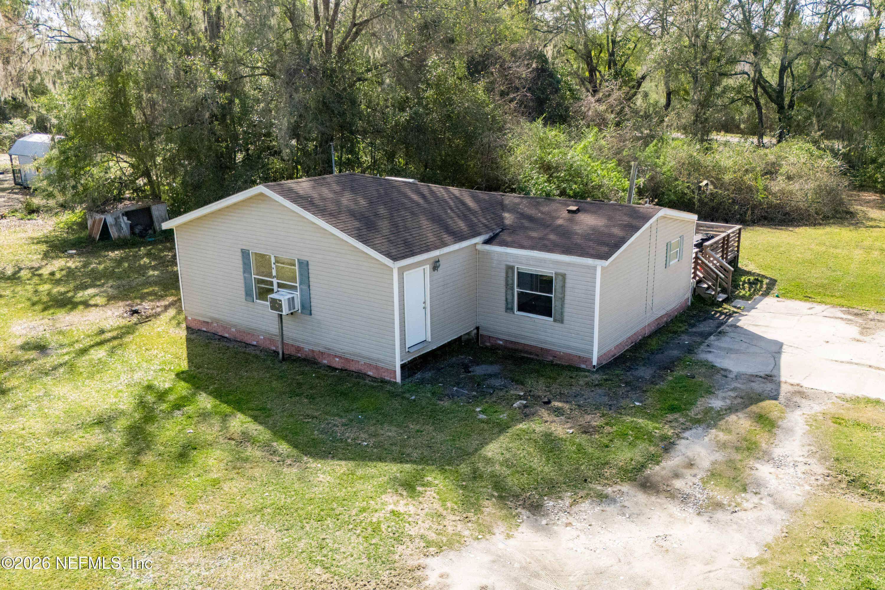 9860 State Rte 100 Starke, FL 32091 - Photo 1 of 24 a aerial view of a house with a yard