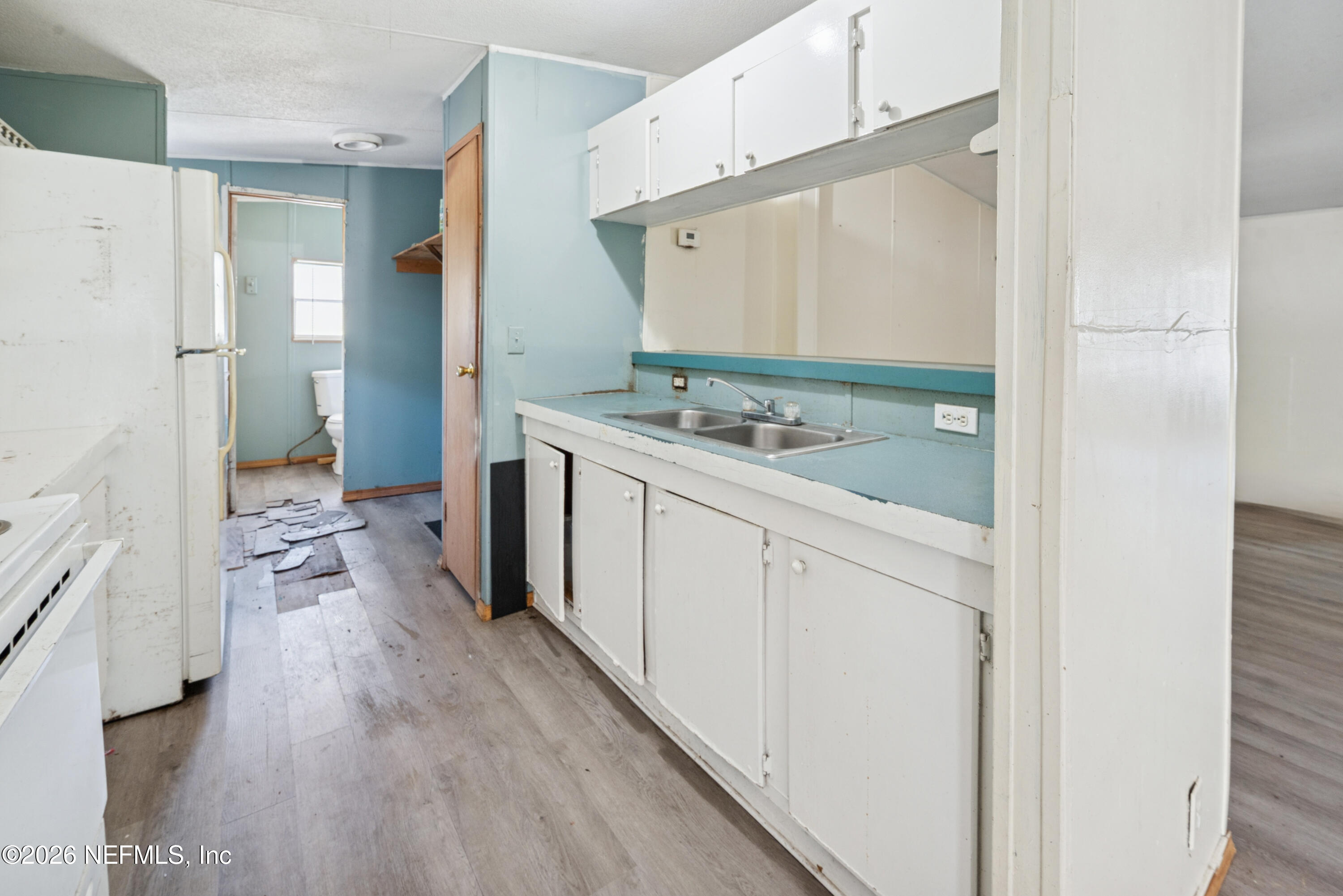 9860 State Rte 100 Starke, FL 32091 - Photo 11 of 24 a spacious bathroom with a granite countertop sink a mirror and shower