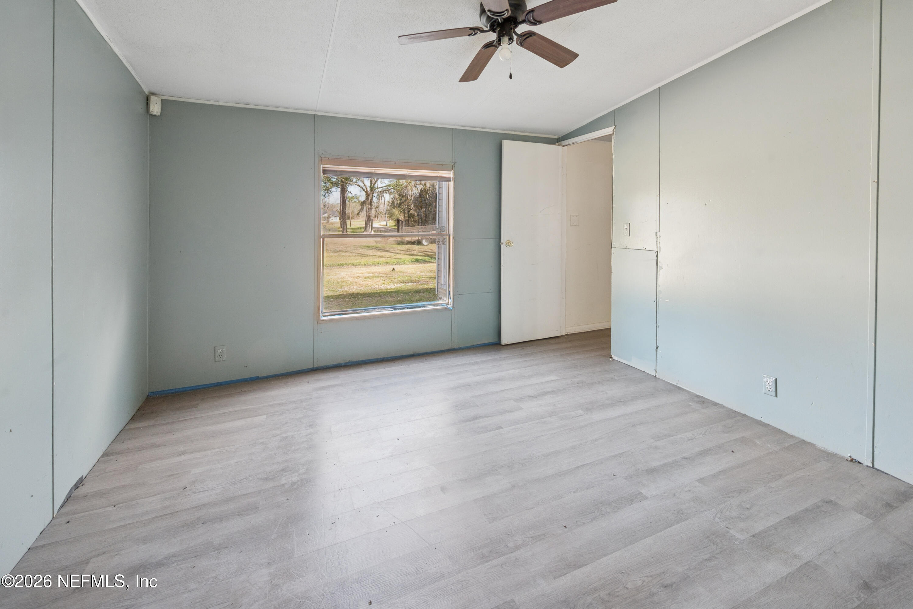 9860 State Rte 100 Starke, FL 32091 - Photo 14 of 24 a view of an empty room with a window