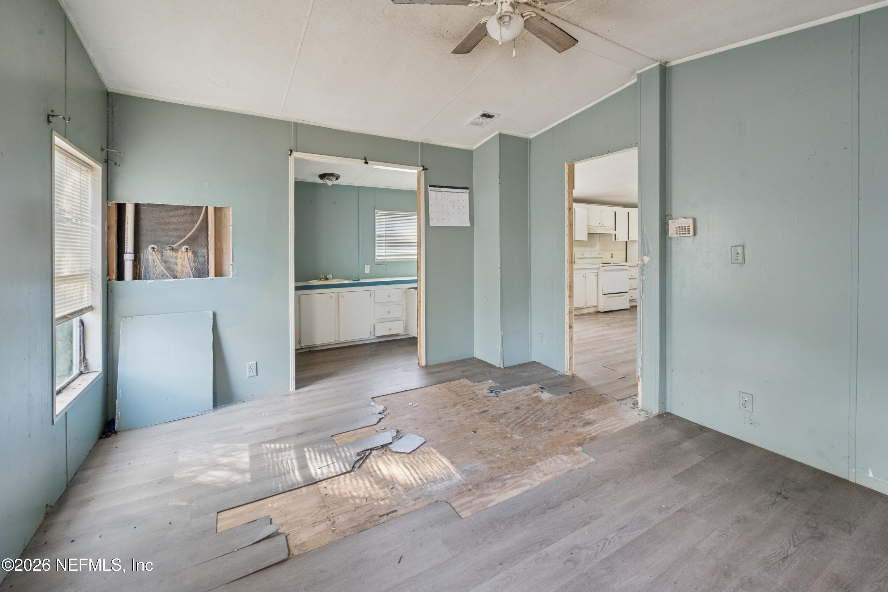 9860 State Rte 100 Starke, FL 32091 - Photo 20 of 24 a view of a room with a stylish ceiling fan and entryway