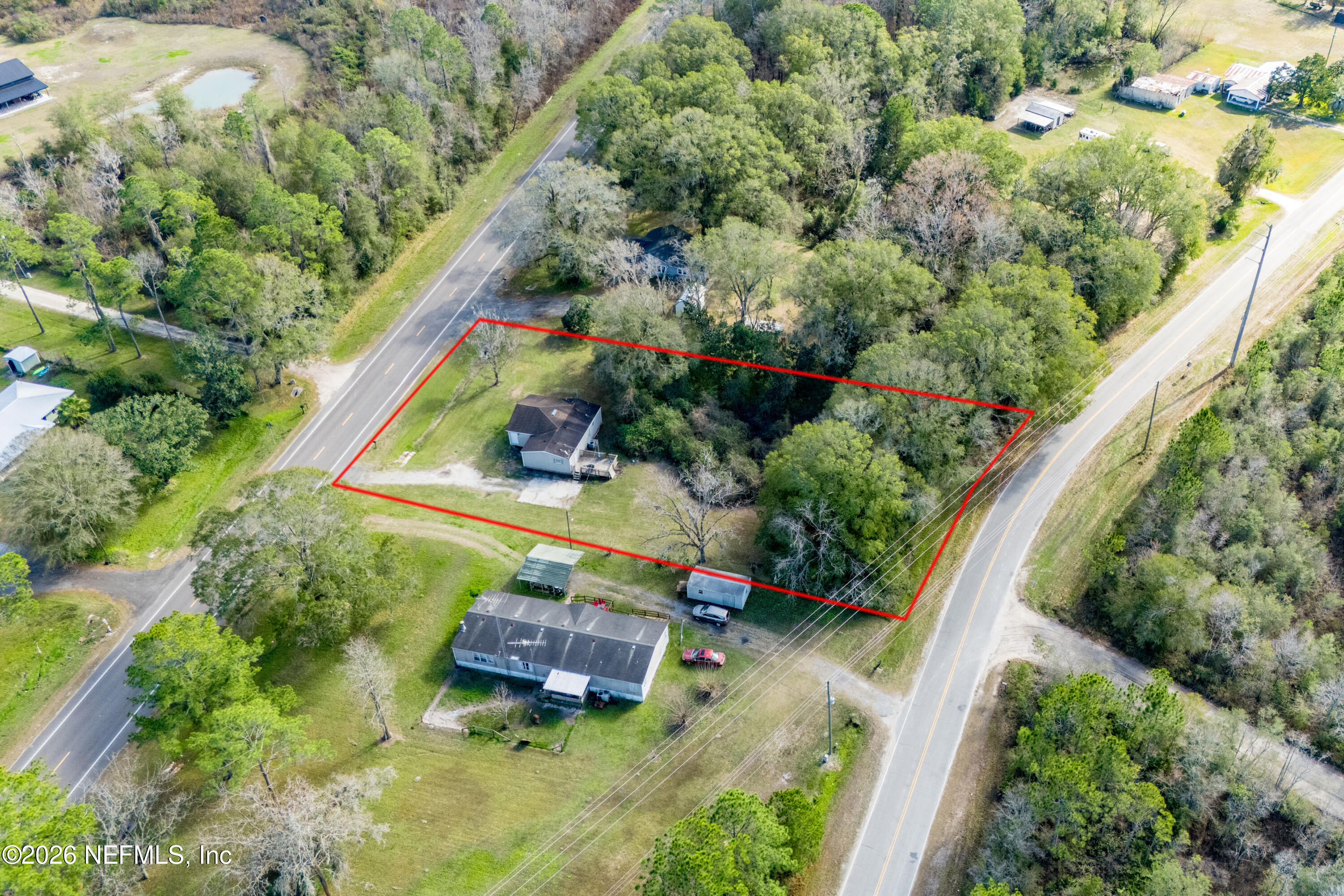 9860 State Rte 100 Starke, FL 32091 - Photo 2 of 24 an aerial view of a house with a yard