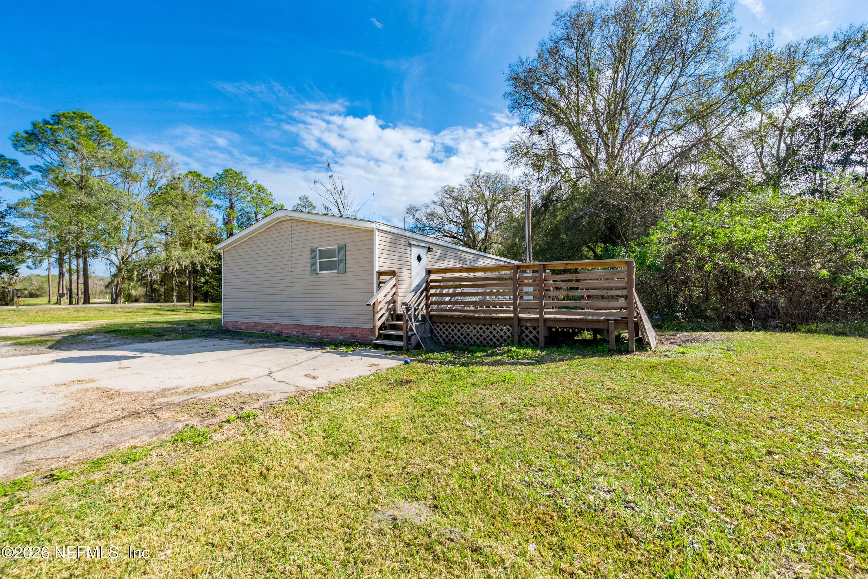 9860 State Rte 100 Starke, FL 32091 - Photo 4 of 24 a backyard of a house with lots of green space