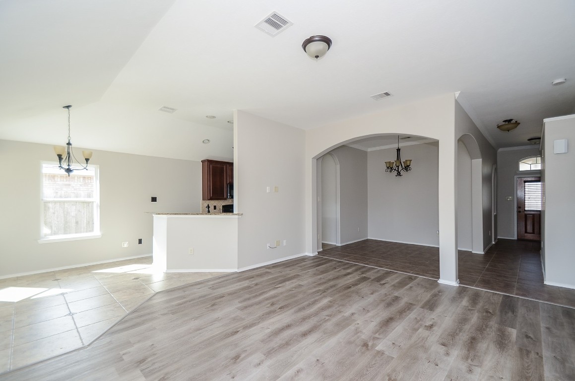 2646 Leopard Court Katy, TX 77449 - Photo 11 of 32 a view of empty room with wooden floor and windows
