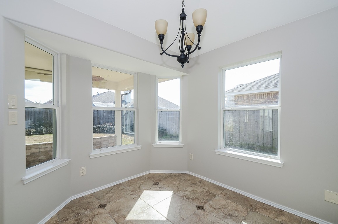2646 Leopard Court Katy, TX 77449 - Photo 12 of 32 a view of empty room with windows