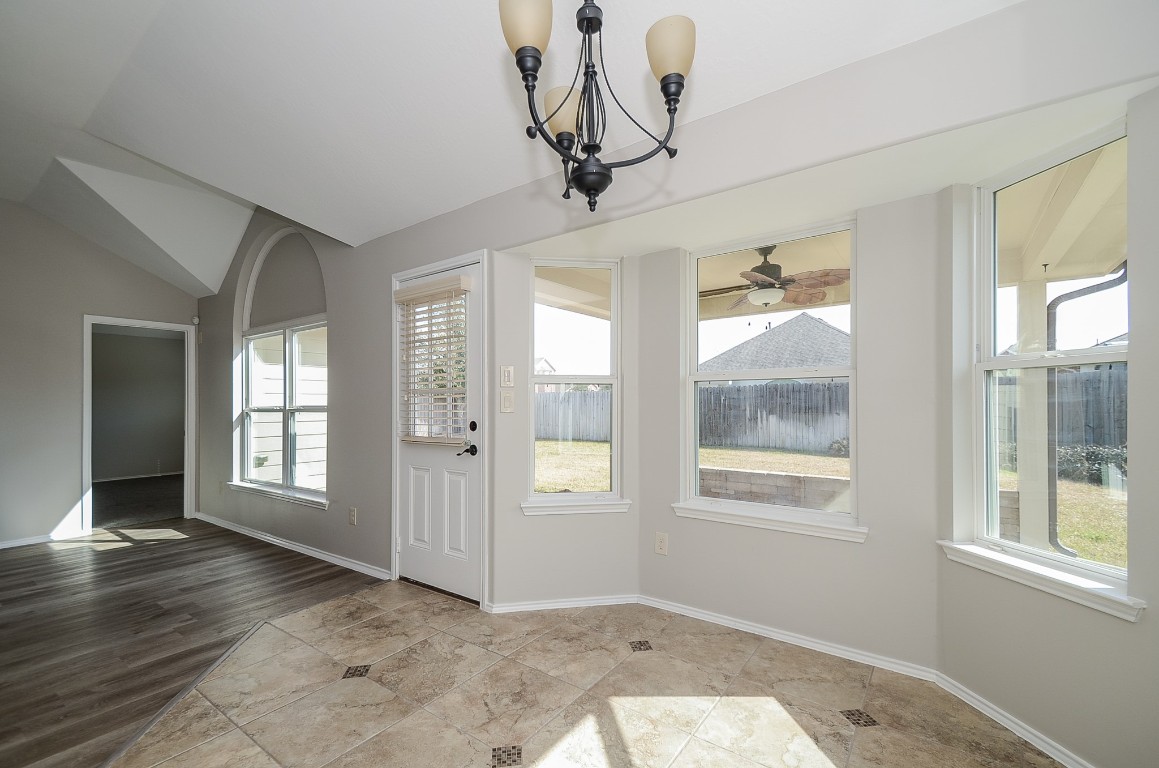 2646 Leopard Court Katy, TX 77449 - Photo 13 of 32 wooden floor in an empty room with a window