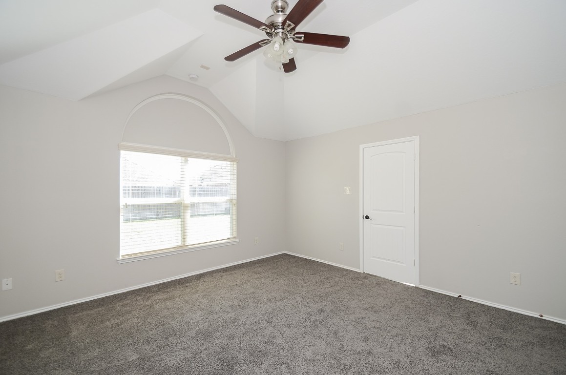 2646 Leopard Court Katy, TX 77449 - Photo 25 of 32 an empty room with a window and a fan
