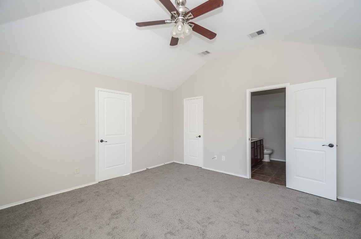 2646 Leopard Court Katy, TX 77449 - Photo 26 of 32 a view of an empty room with a ceiling fan