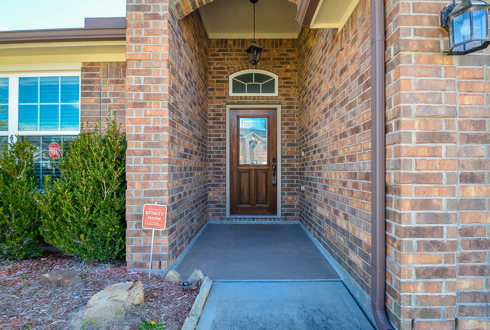 2646 Leopard Court Katy, TX 77449 - Photo 3 of 32 a view of a brick house with a large windows