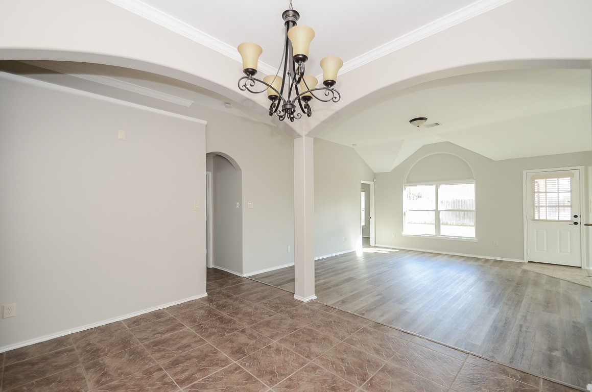 2646 Leopard Court Katy, TX 77449 - Photo 7 of 32 a view of a livingroom with a chandelier fan and windows