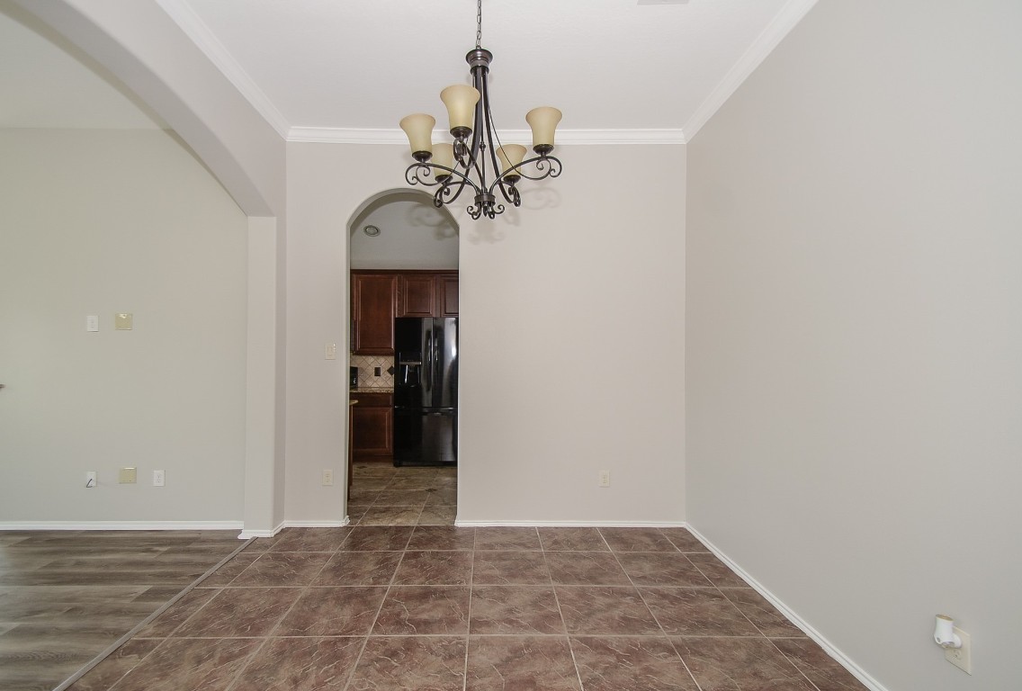 2646 Leopard Court Katy, TX 77449 - Photo 8 of 32 a view of a chandelier in a room