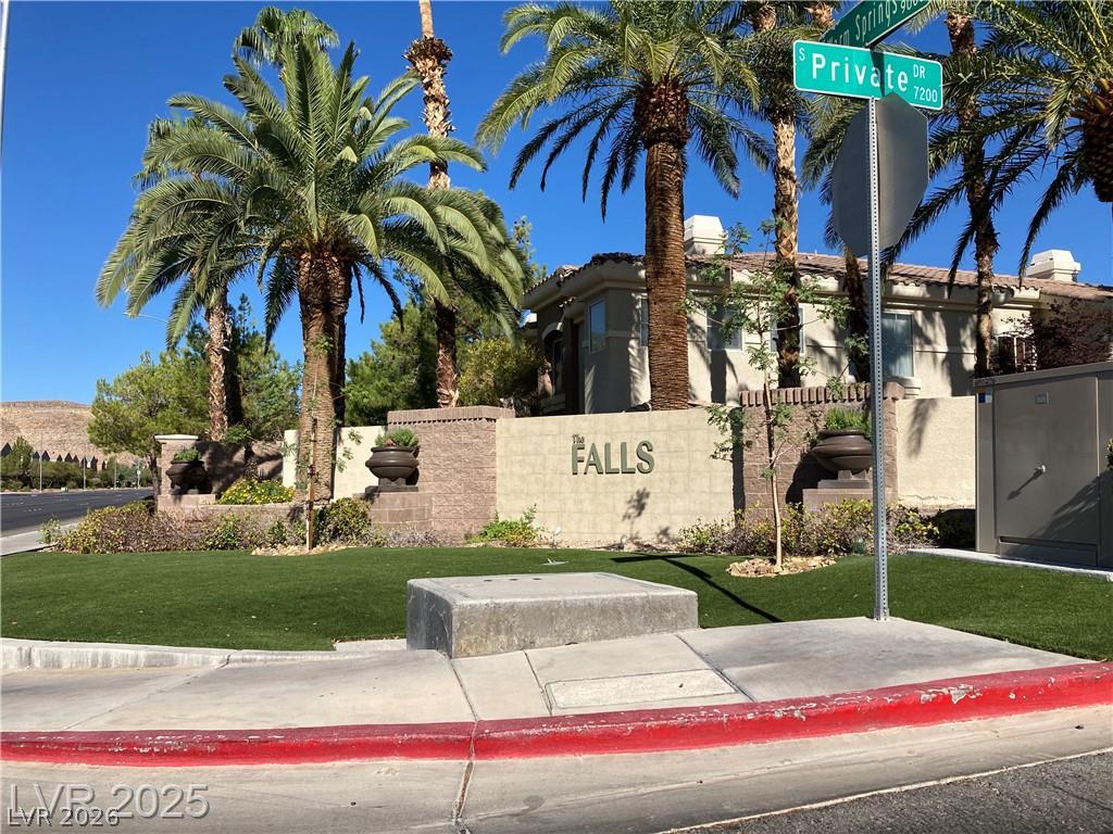 9050 West Warm Springs Road, Unit 1027 Las Vegas, NV 89148 - Photo 43 of 44 Mature palm trees frame the grand entrance to this desirable community.