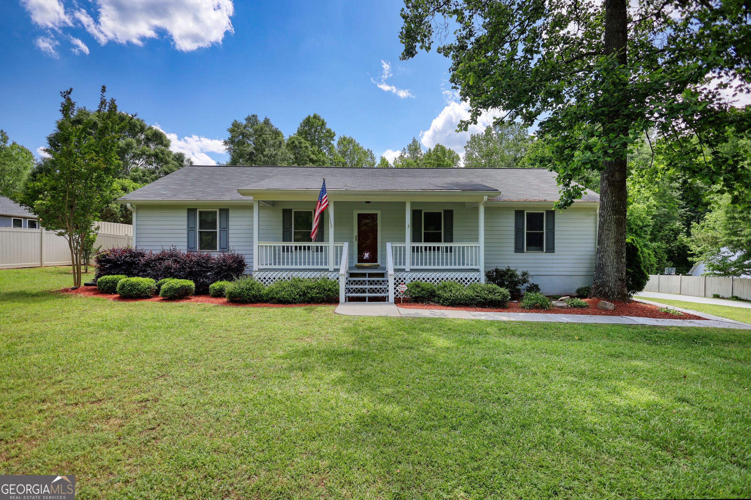1130 Rawlings Drive Rutledge, GA 30663 - Photo 1 of 1 a front view of house with yard and green space