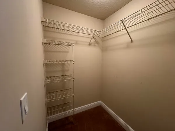 a view of a room with racks on the wall