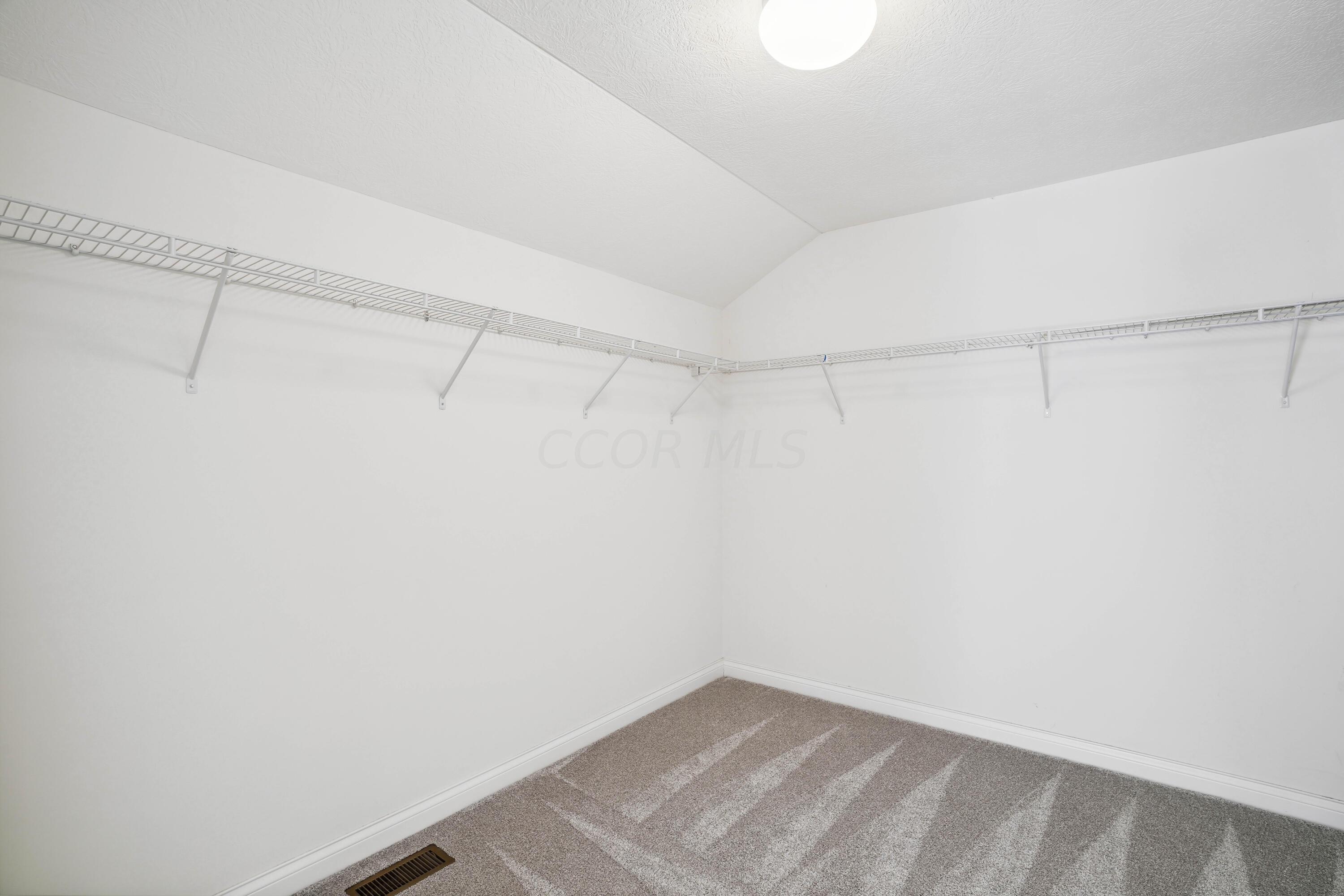 10403 Liberty Road Powell, OH 43065 - Photo 49 of 76 Large 2nd Floor Primary Suite with HUGE Walk-in closet and OnSuite Bath with double vanity, water closet, walk-in shower and soaking tub!