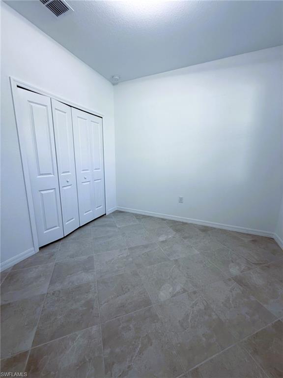 2648 Vine Avenue Naples, FL 34120 - Photo 12 of 20 a view of an empty room