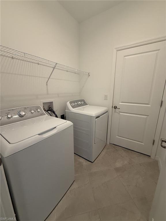 2648 Vine Avenue Naples, FL 34120 - Photo 15 of 20 a utility room with dryer and washer