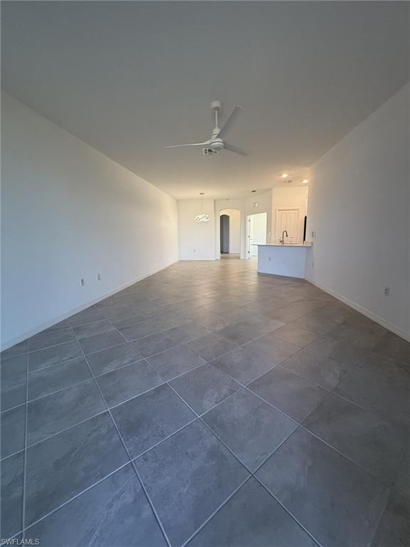 2648 Vine Avenue Naples, FL 34120 - Photo 5 of 20 a view of empty room with windows and cabinet