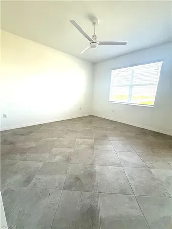 a view of an empty room and a window