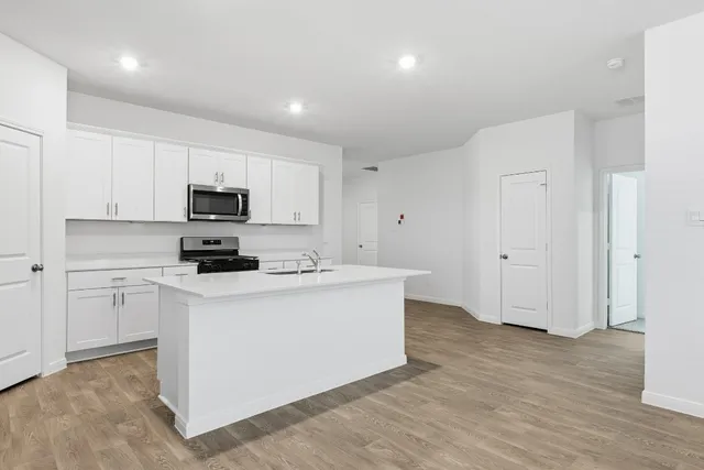 a view of kitchen with wooden floor