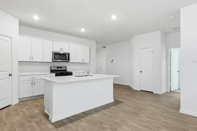 a view of kitchen with wooden floor