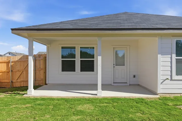 a view of house with yard