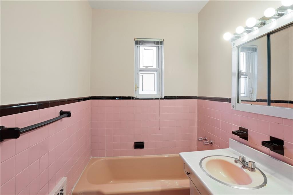 2815 Ave Y Brooklyn, NY 11235 - Photo 16 of 21 a bathroom with a sink a toilet and a bathtub