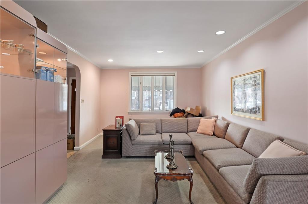 2815 Ave Y Brooklyn, NY 11235 - Photo 5 of 21 a living room with furniture and a window