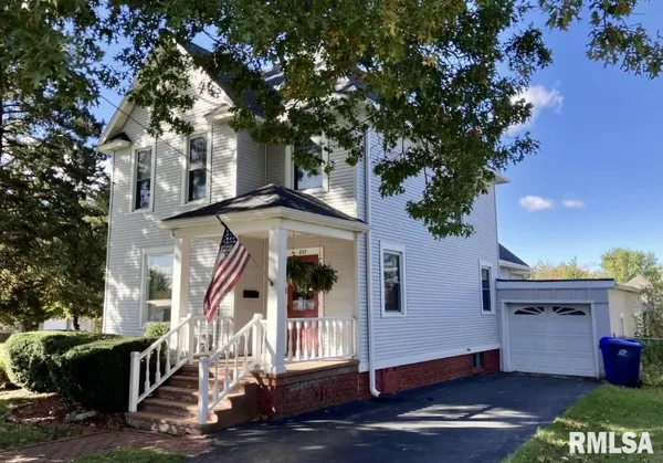 a front view of a house with a porch