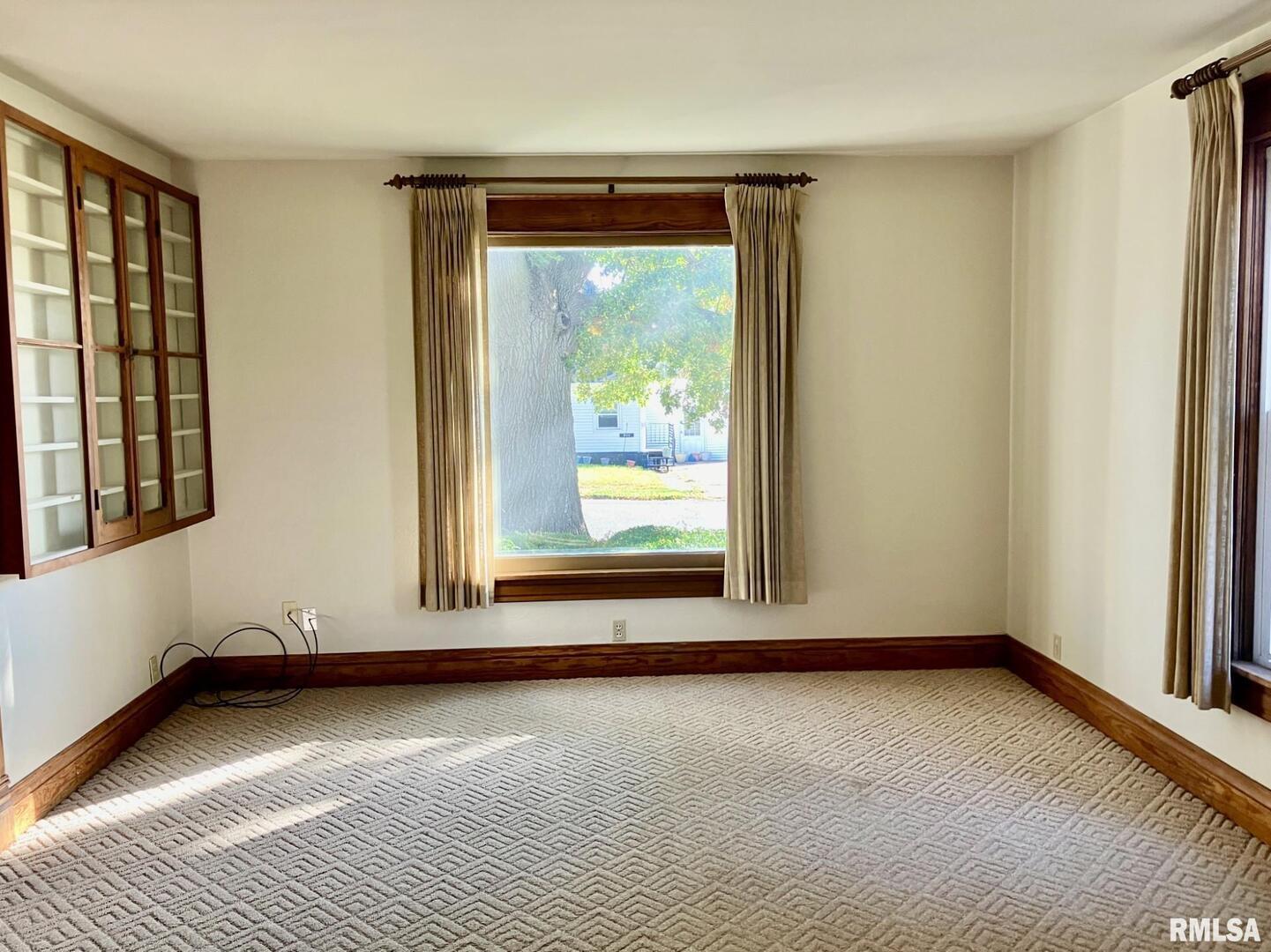 837 Beach Street Kewanee, IL 61443 - Photo 11 of 54 a view of an empty room with window