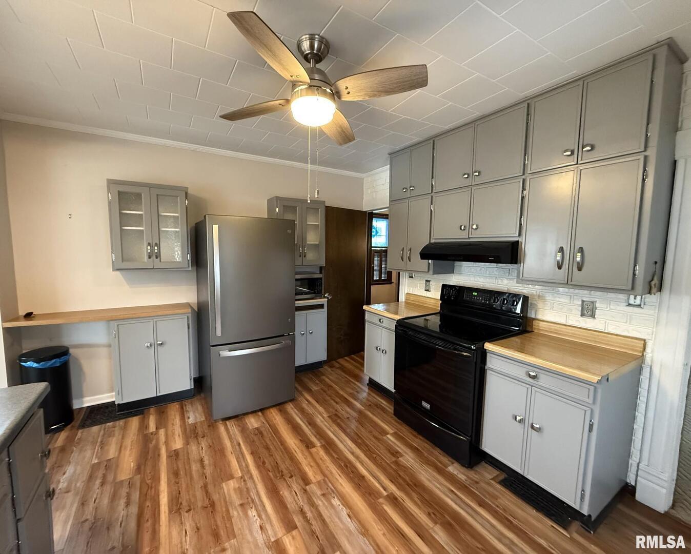 837 Beach Street Kewanee, IL 61443 - Photo 16 of 54 a kitchen with a sink appliances and cabinets