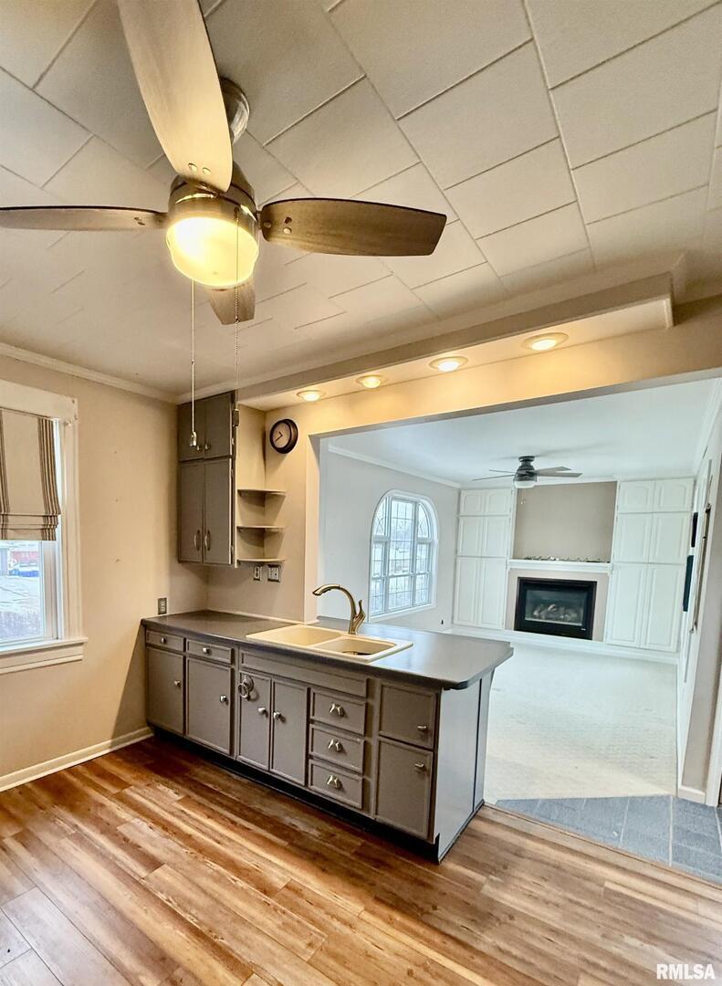 837 Beach Street Kewanee, IL 61443 - Photo 18 of 54 a kitchen with stainless steel appliances granite countertop a sink and cabinets