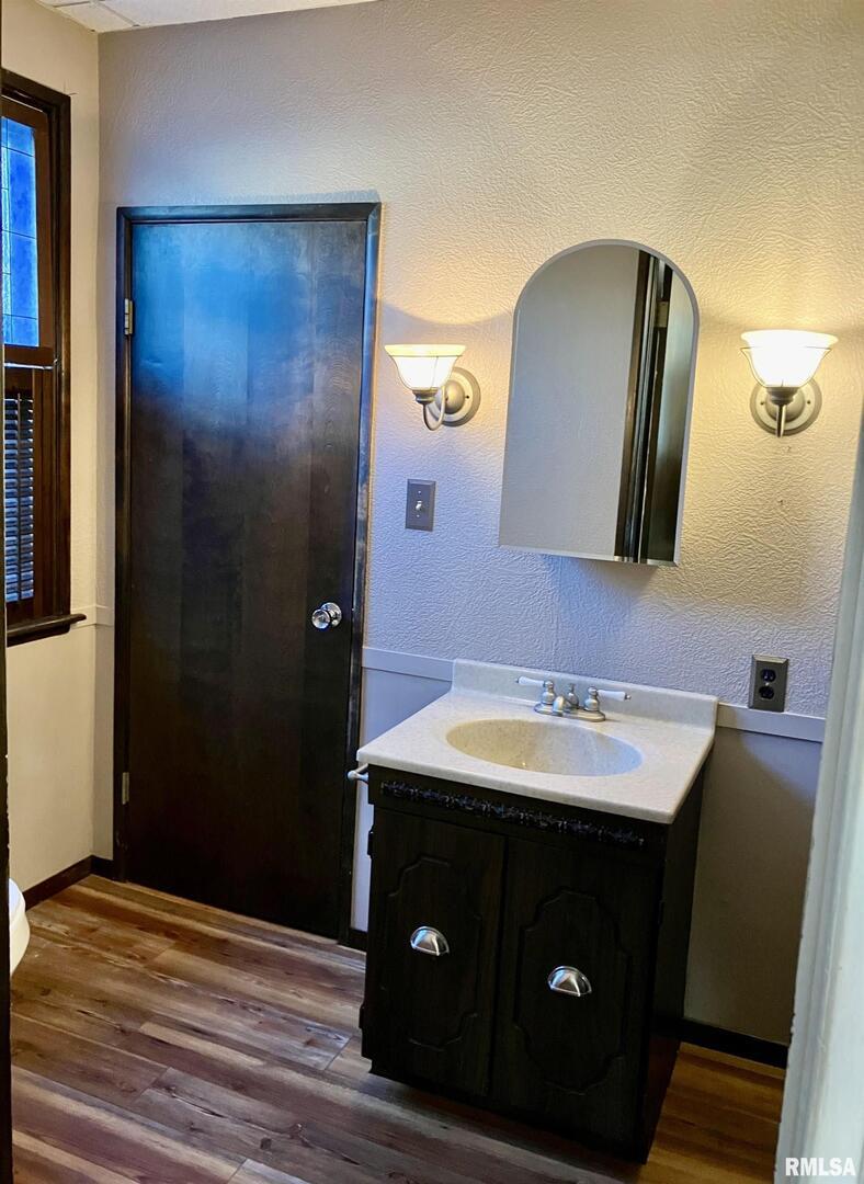 837 Beach Street Kewanee, IL 61443 - Photo 24 of 54 a bathroom with a sink and a mirror