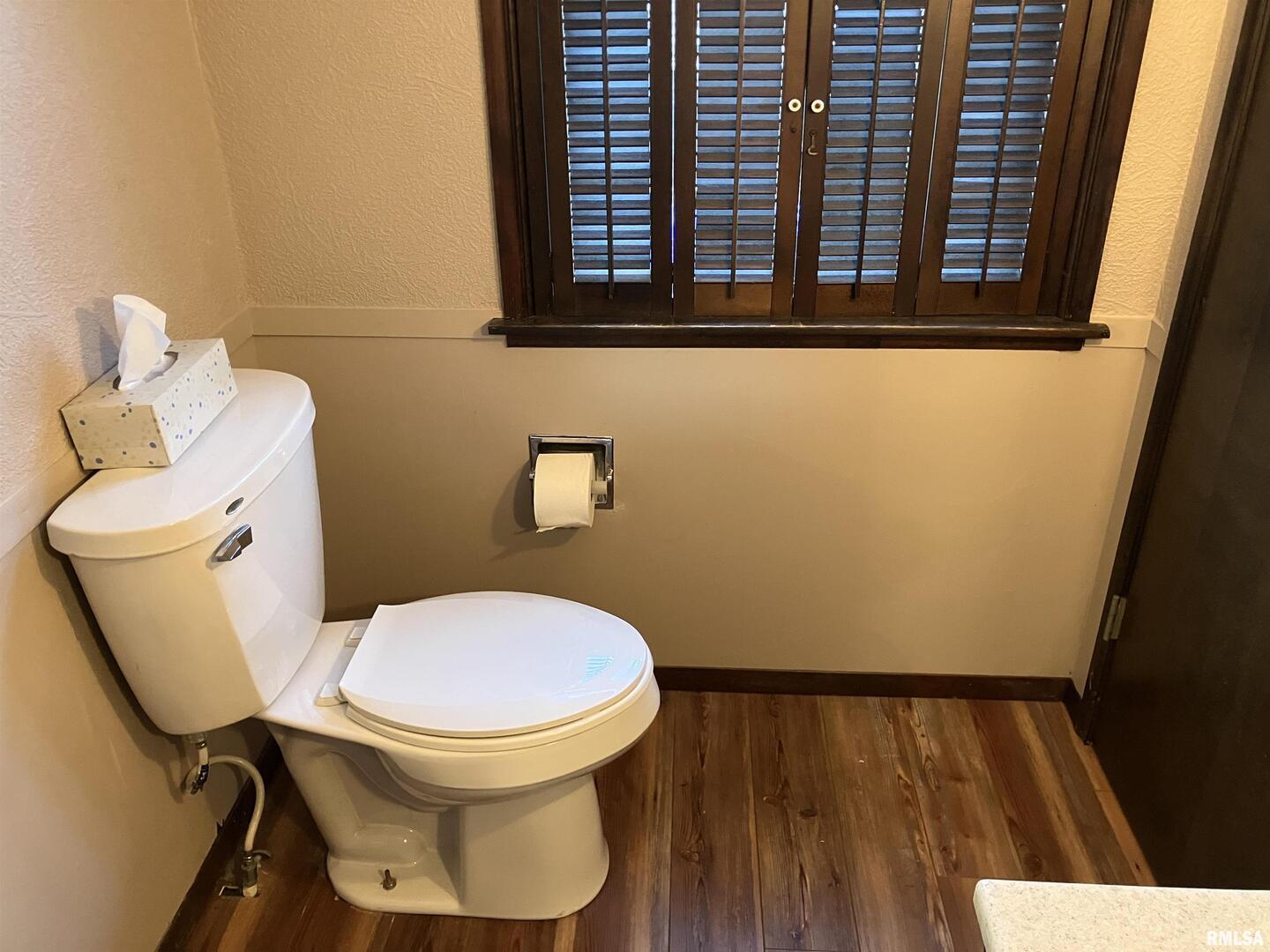 837 Beach Street Kewanee, IL 61443 - Photo 26 of 54 a bathroom with a toilet and a window