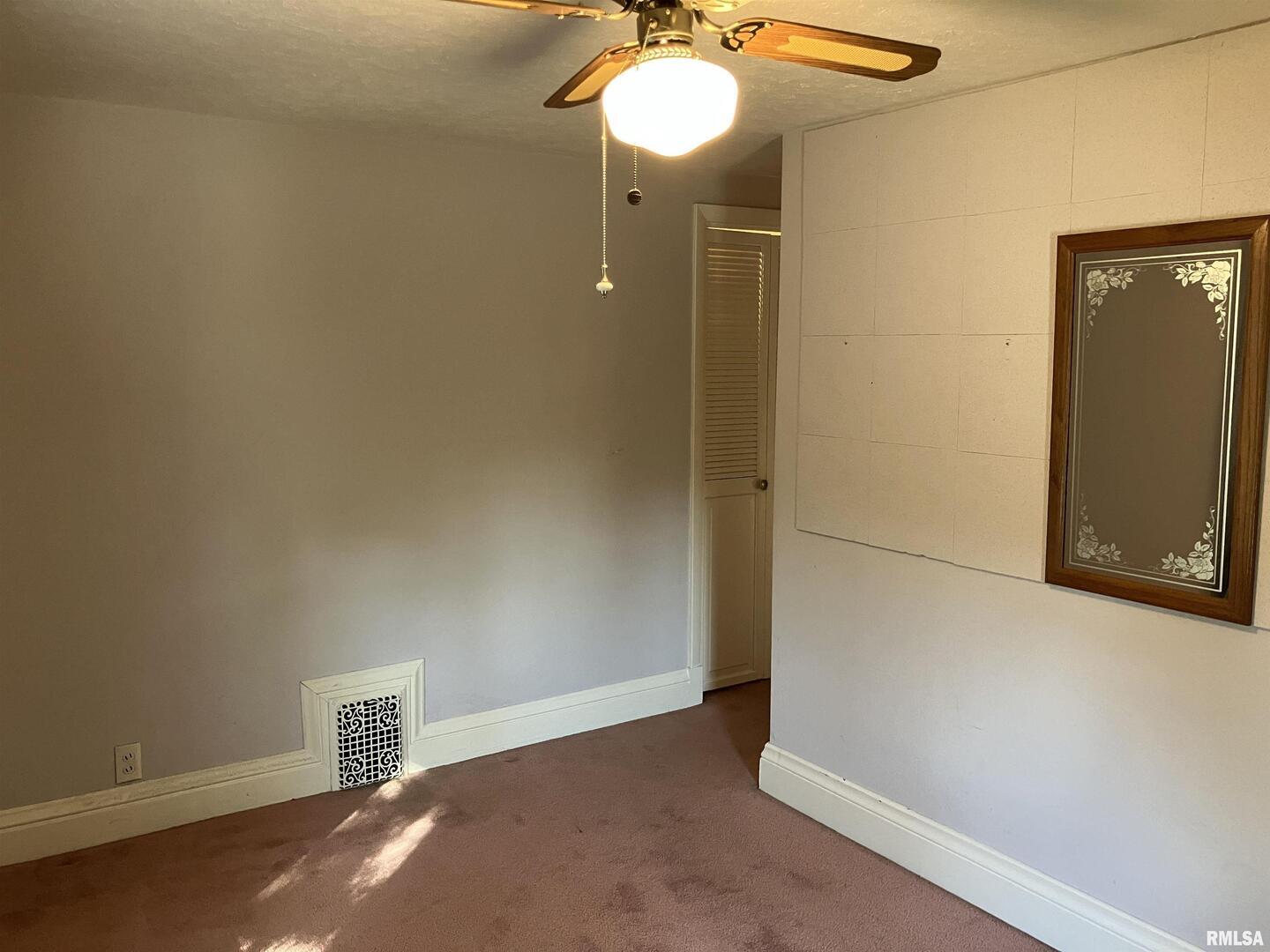 837 Beach Street Kewanee, IL 61443 - Photo 34 of 54 a view of a room with wooden floor and white walls