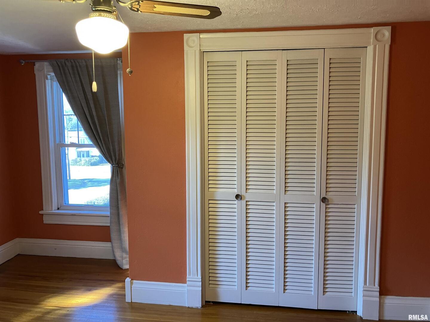 837 Beach Street Kewanee, IL 61443 - Photo 36 of 54 a view of a room with a window and wooden floor