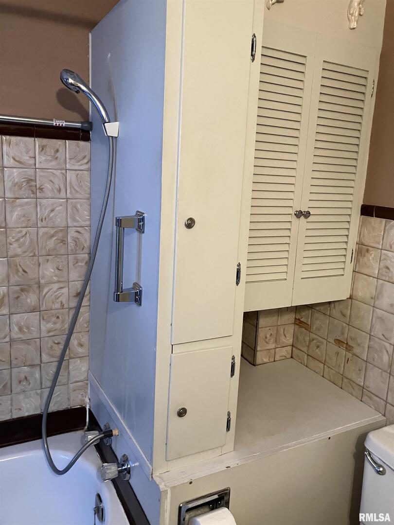 837 Beach Street Kewanee, IL 61443 - Photo 40 of 54 a bathroom with a shower and a sink