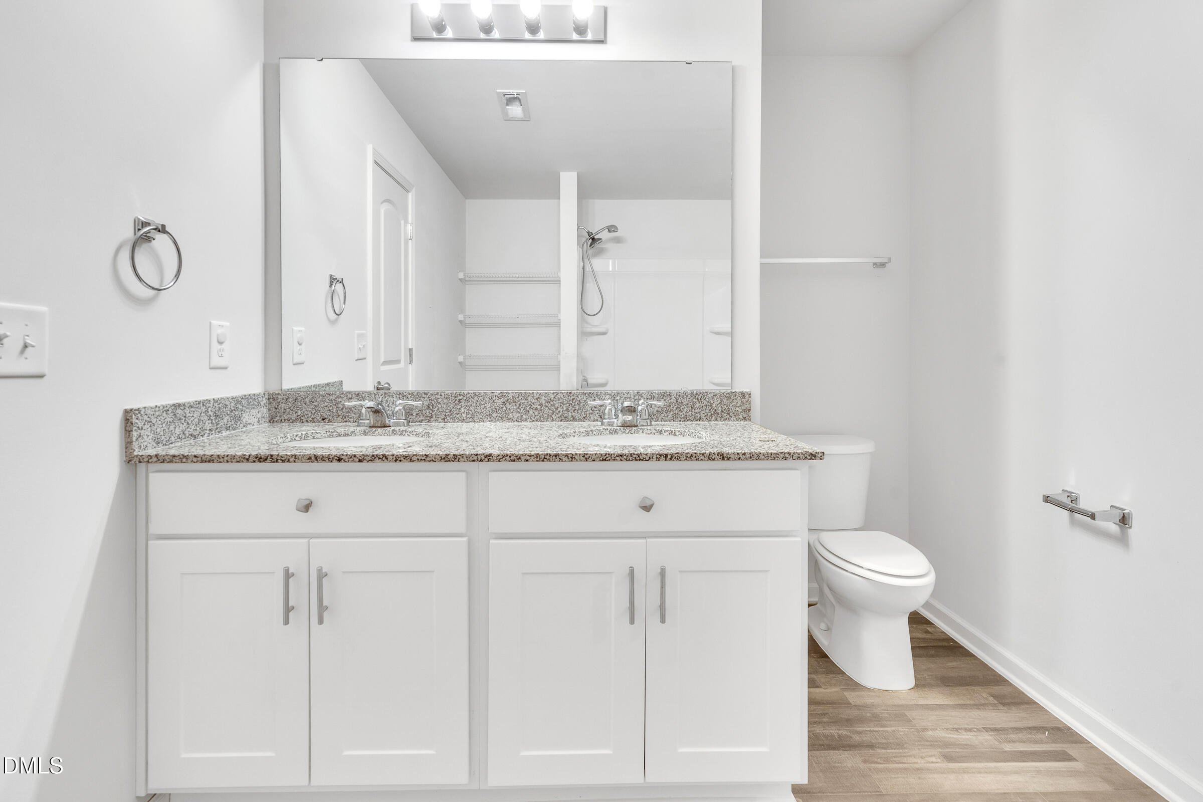 3146 Stoney Hill Church Road Bailey, NC 27807 - Photo 20 of 26 a bathroom with a granite countertop sink a toilet and a mirror